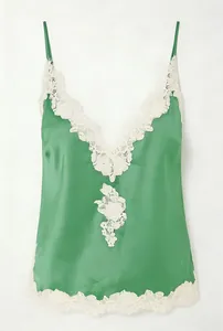 Detail view of the green satin camisole featuring delicate white lace trim on the V-neckline
