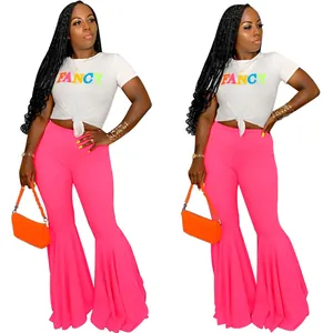 Pantalones de campana rosa neón sexys de corte ajustado con volantes en capas