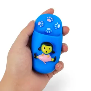 Blue squeaky vinyl slipper dog toy with cartoon girl figure being held in hand