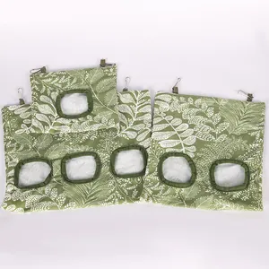 Hanging hay feeder bags with green leaf pattern for rabbits and guinea pigs in various sizes