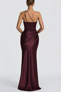 Back view of a plum satin one-shoulder mermaid evening gown with lace-up detail
