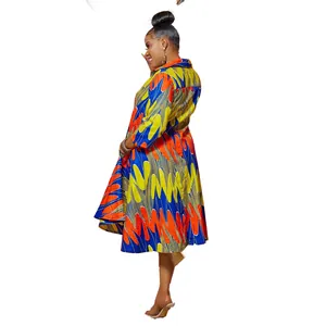Detail view of colorful African print long sleeve shirt dress with lapel collar