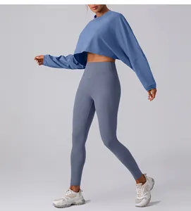 Detailed view of women's blue cropped long-sleeve yoga sweatshirt for athletic training