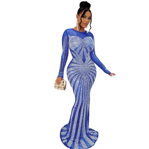 Full-body detail of sexy floor-length blue dress with radiant silver rhinestone patterns