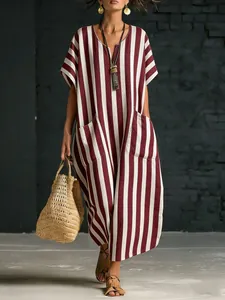 Detail view of the relaxed fit and bold vertical stripes on this V-neck maxi dress.