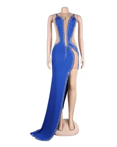 Elegant royal blue evening gown featuring intricate rhinestones and a daring high slit