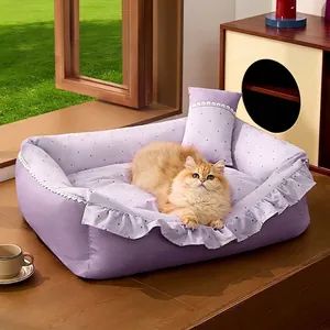 Comfortable purple ruffled pet bed with polka dots for cats and dogs