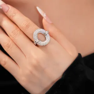 Detail of silver-tone hollow circular ring with pave-set sparkling zircons