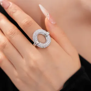Close-up detail of a sparkling silver pavé zircon circular hollow open ring for women.
