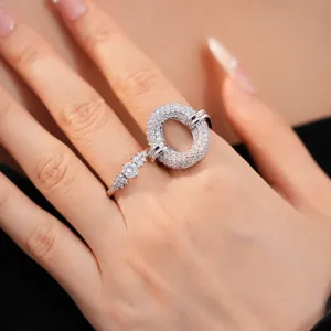 Detailed view of pavé zircon hollow oval ring with exquisite silver finish on finger.