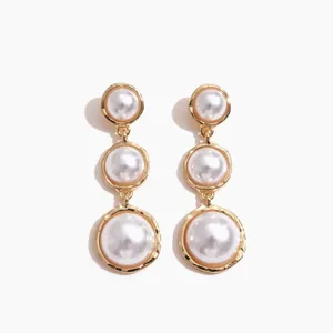 Elegant vintage gold-toned triple faux pearl drop earrings for women, classic jewelry piece