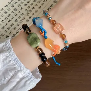 Set van 3 nieuwe Chinese stijl armbanden met koi bedeltjes en houten kralen om de pols
