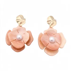 Elegant peach acrylic flower earrings with center pearl and pleated gold metal accent