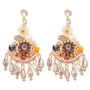 Elegant Bohemian vintage style crystal drop earrings with pink center stone and champagne beads