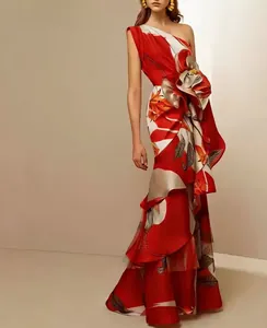 Elegant red floral one-shoulder gown with layered asymmetrical ruffles and waist cinching