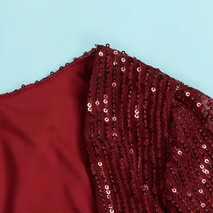 Macro detail of wine red sequin embroidery on mesh fabric for elegant party dress