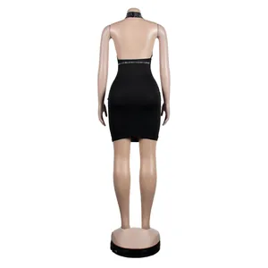 Rear view detail of a sexy black halter-neck bodycon dress with rhinestone accents