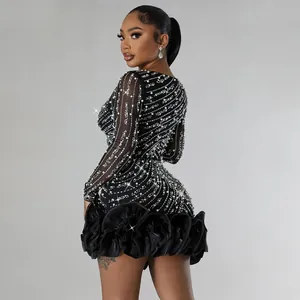 Elegant long sleeve black mini dress featuring intricate rhinestone and pearl embellishments