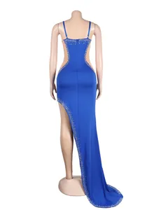 Back view of a sexy blue rhinestone mesh evening gown with a long trailing hem.