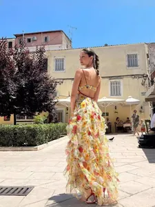 Elegant floral organza maxi evening dress with backless design and ruffled layers