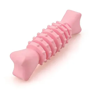 Pink TPR dog chew toy with textured ridges for dental cleaning and teething relief.