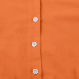 Detailed close-up showing white buttons on high-quality orange cotton linen fabric texture