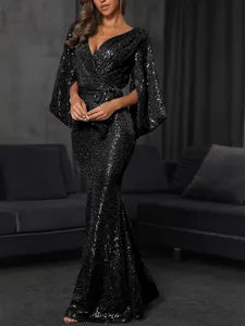 Elegant black sequined floor-length evening gown with V-neck and cape sleeves.