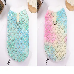 Detail view of two gradient fish-scale pet hoodies with integrated leash D-rings.