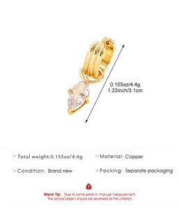 Vue détaillée d'une manchette d'oreille en cuivre doré avec un zircon marquise pendant
