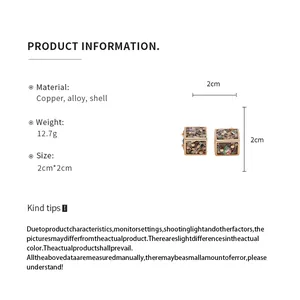 Spécifications de taille et matière pour boucles d'oreilles cube à incrustation.