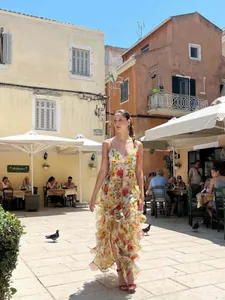 Elegant floral organza maxi dress with ruffled tiers and thin straps for summer evening wear