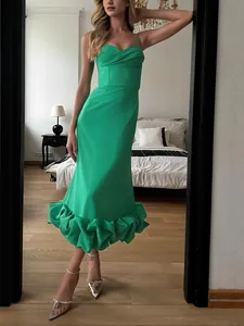 Elegant slim fit green spaghetti strap midi dress featuring a corset bodice and ruffled hemline