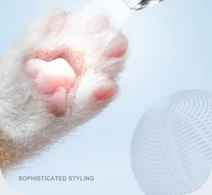 Close-up view of pet hair clipper trimming cat's paw hair with sophisticated styling