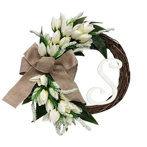Elegant artificial white tulip wreath featuring a burlap bow and wooden letter S detail