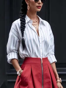 Elegant women's casual blue and white vertical striped long-sleeved button-up blouse with lapel