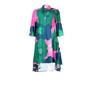 Detailed view of a vibrant floral print midi dress with lapel collar and buttons.