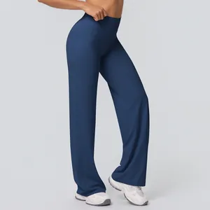 Side view detail of navy high-waisted yoga flare pants with brushed fabric texture