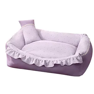 Purple polka dot pet sofa bed featuring ruffle trim and a small matching pillow accessory