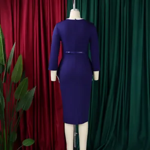 Back view of elegant navy blue long-sleeved pencil dress showing slim belt and zipper.