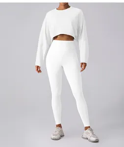 Women's white cropped long sleeve sweatshirt and matching high waist yoga leggings set