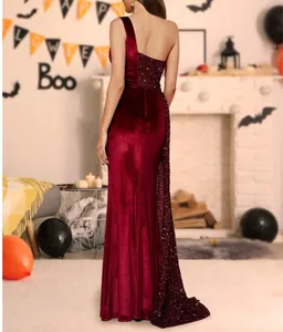 Back view of a luxurious one-shoulder red velvet evening dress with sequin details.