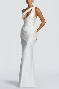 Close-up of an elegant white satin one-shoulder mermaid maxi dress with pleated cutouts