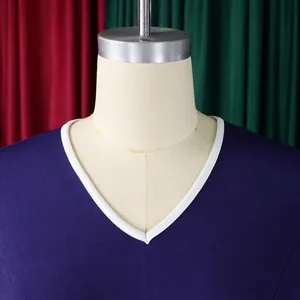 Close-up of elegant V-neck detail on professional long-sleeved pencil dress.