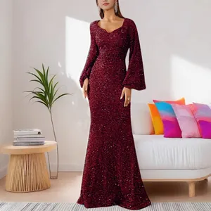 Full length view of wine red sequined V-neck evening gown with flare sleeves on model