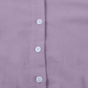 Close-up detail showing the purple cotton linen fabric texture and white buttons