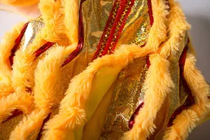 Detailed close-up of yellow pet lion dance costume with golden sequins and soft faux fur