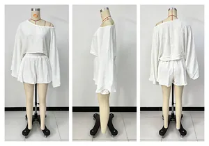 Detailed front side and back view of white long-sleeve top and shorts set on mannequin