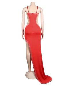 Back view of red backless evening gown with rhinestone trim and illusion mesh detail.