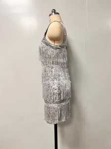 Side view of silver sequined cocktail dress featuring elegant layered fringe tassels