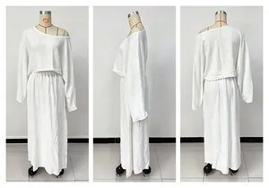 White two-piece set featuring a loose long sleeve top and maxi skirt from multiple angles